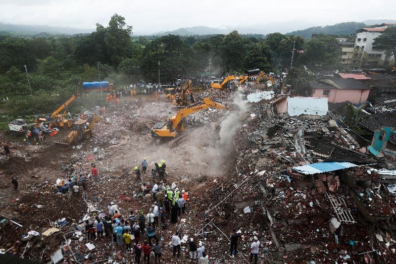 Rescue workers search for survivors in the debris after a five-story building collapsed in Mahad in Raigad district in Maharashtra, August 25, 2020. REUTERS/Francis Mascarenhas